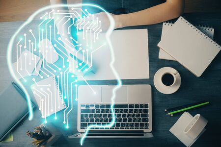 Multi exposure of writing hand on background with brain hologram. Concept of learning.の写真素材