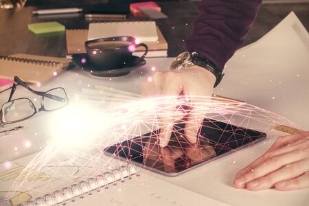 Double exposure of mans hands holding and using a phone and social network theme drawing.の写真素材