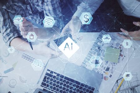 Double exposure of data theme hologram drawing and man and woman working together holding and using a mobile device.の写真素材