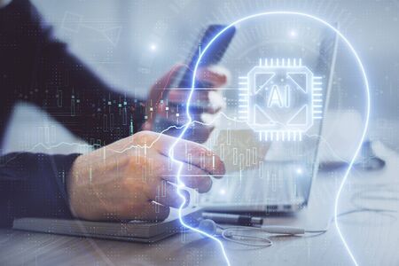 Double exposure of mans hand holding and using a digital device and brain hologram drawing. Data...