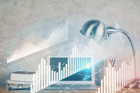 Double exposure of graph and financial info and work space with computer background. Concept of international online trading.の写真素材