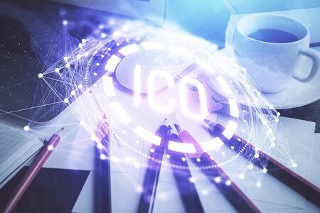 Multi exposure of blockchain and crypto economy theme hologram and table with computer background. Concept of bitcoin cryptocurrency.の写真素材