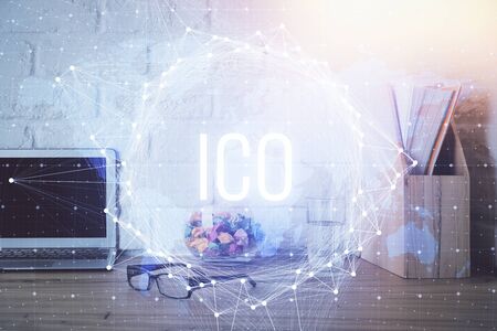 Multi exposure of blockchain and crypto economy theme hologram and table with computer background....