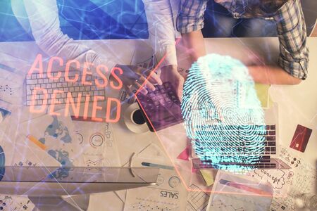 Double exposure of man and woman working together and fingerprint drawing. Computer background. Top...