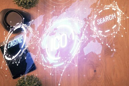 Double exposure of blockchain theme hologram over table with phone. Top view. Crypto technology...