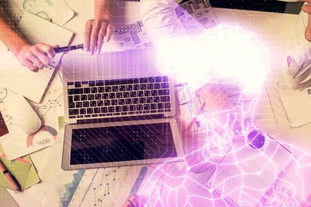 Double exposure of man and woman working together and human in ar, vr glasses hologram drawing. Technology virtual reality concept. Computer background.の写真素材