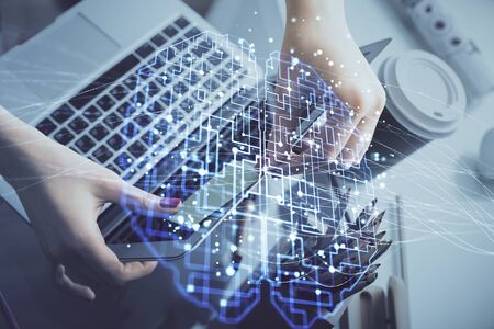 Multi exposure of woman hands working on computer and human brain hologram drawing. Ai tech concept.