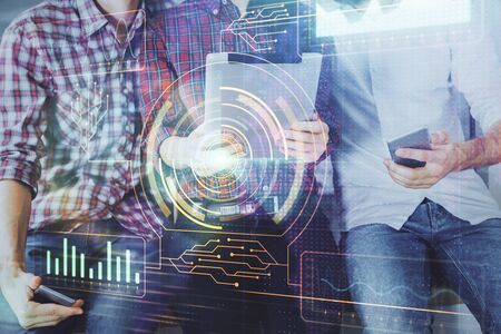 Double exposure of data theme hologram drawing and man and woman working together holding and using...