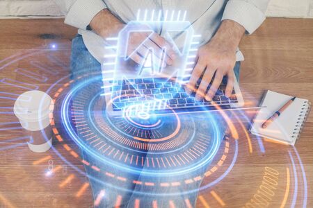 Multi exposure of data internet theme hologram with man working on computer on background. Concept of innovation.の写真素材