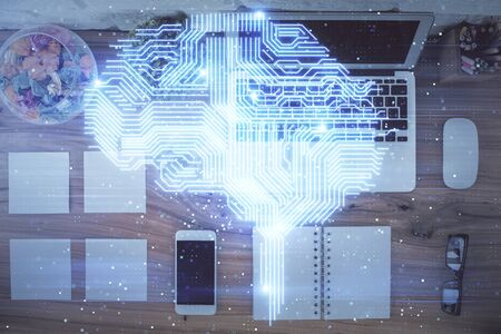 Double exposure of brain drawing hologram over topview work table background with computer. Concept...