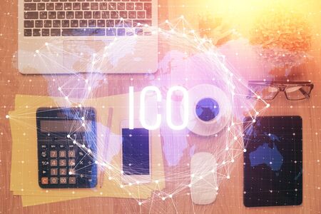 Double exposure of blockchain theme hologram over table with phone. Top view. Crypto technology concept.の写真素材