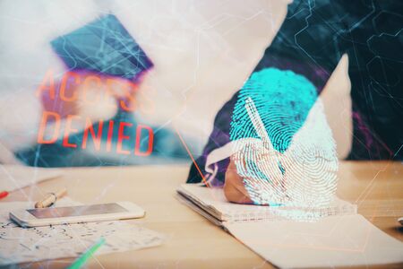 Double exposure of fingerprint drawing over people taking notes background. Concept of securityの写真素材