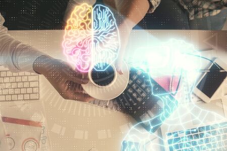 Double exposure of man and woman working together and man in virtual glasses hologram drawing. Computer background. Top View. VR, AR concept.の写真素材