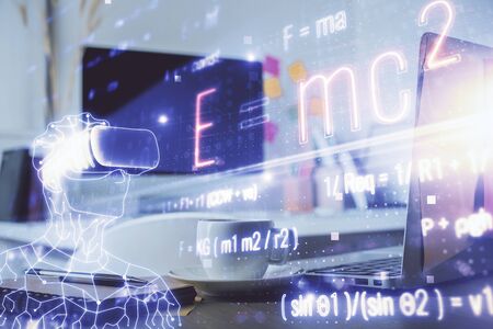 Desktop computer background and formula hologram writing. Double exposure. Education concept.の写真素材