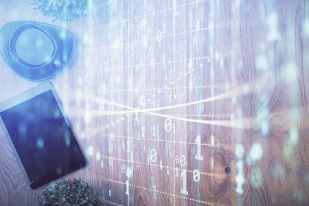 Double exposure of technology theme drawing over work table desktop. Top view. Global data analysis concept.の写真素材