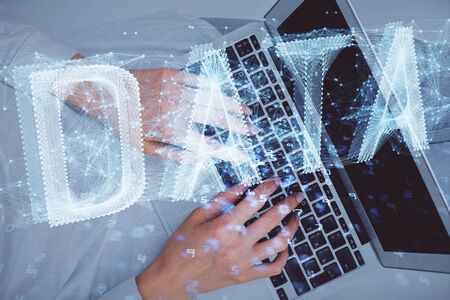 Double exposure of woman hands working on computer and data theme hologram drawing. Top View. Technology concept.の写真素材