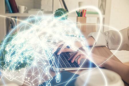 Double exposure of woman hands typing on computer and business theme hologram drawing. Success concept.の写真素材