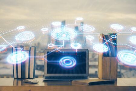 Computer on desktop with social network theme icon. Multi exposure. Concept of international connections.の写真素材