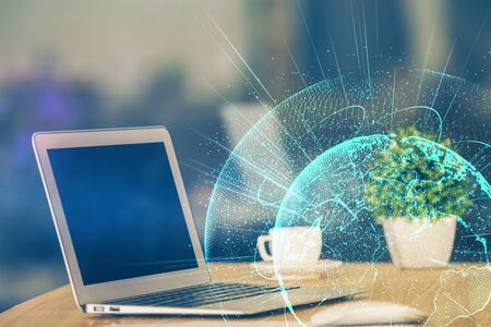 Computer on desktop with social network theme icon. Multi exposure. Concept of international...