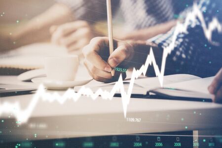 Multi exposure of two men planing investment with stock market forex chart background. Concept of research and trading.の写真素材