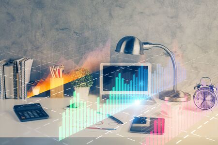 Multi exposure of chart and financial info and work space with computer background. Concept of international online trading.の写真素材