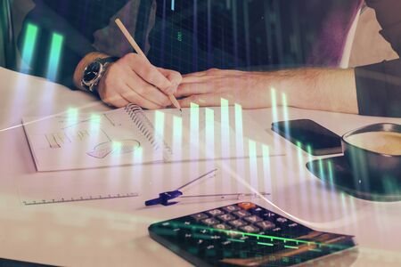 Double exposure of man doing analysis of stock market with forex graph. Concept of research and trading.の写真素材
