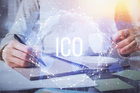 Cryptocurrency hologram over womans hands writing background. Concept of blockchain. Multi exposureの写真素材