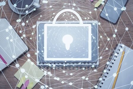 Double exposure of lock drawing over desktop. Top view. Security concept.