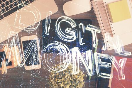 Double exposure of blockchain theme hologram over table with phone. Top view. Crypto technology concept.の写真素材