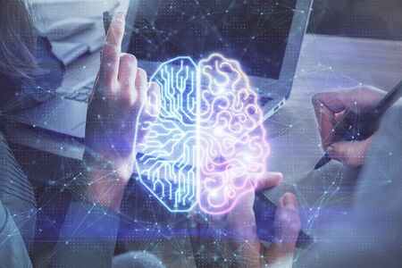 Double exposure of man and woman working together and brain drawing hologram. Intellectual...
