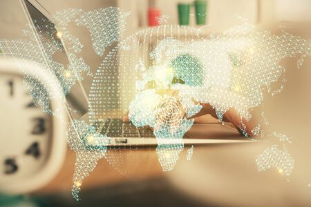 Double exposure of woman hands typing on computer and business theme hologram drawing. Success concept.の写真素材