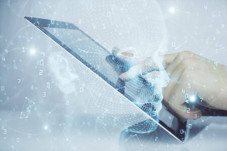 Double exposure of mans hand holding and using a digital device and brain hologram drawing. Data concept.の写真素材
