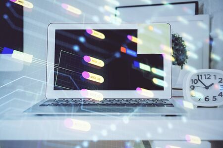 Technology theme drawing and work space with computer. Double exposure. Concept of innovation.の写真素材