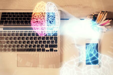 AR hologram drawings over computer on the desktop background. Top view. Multi exposure. Concept of augmented reality.の写真素材