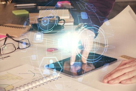 Double exposure of mans hands holding and using a phone and social network theme drawing.の写真素材