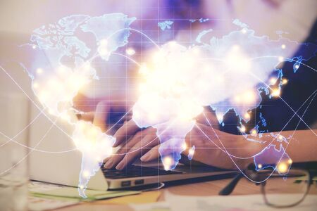 Multi exposure of woman hands typing on computer and business theme hologram drawing. Success concept.の写真素材