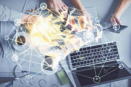 Double exposure of man and woman working together and human brain hologram drawing. Brainstorm concept. Computer background. Top View.の写真素材