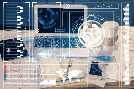 Double exposure of laptop computer and technology theme hologram. Concept of freelance work.