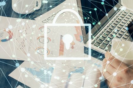 Multi exposure of lock icon with man working on computer on background. Concept of network...