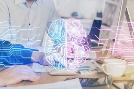 Man with computer background with brain theme hologram. Concept of brainstorm. Double exposure.の写真素材