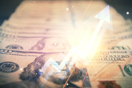 Double exposure of grow arrows drawing over usa dollars bill background. Concept of success.の写真素材