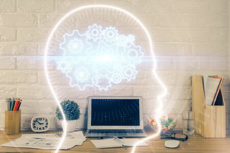 Double exposure of work space with computer and human brain drawing hologram. Brainstorm concept.の写真素材