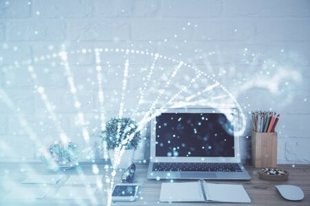 Desktop computer background and DNA drawing. Double exposure. Science concept.の写真素材