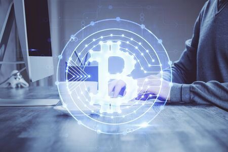 Blockchain theme hud with businessman working on computer on background. Concept of crypto chain. Multi exposure.の写真素材