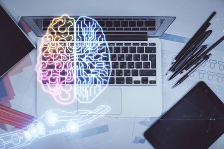 Multi exposure of brain sketch hologram over topview work table background with computer. Concept of...