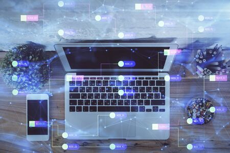 Double exposure of data hologram sketch over study table background with computer. Concept of Ai....