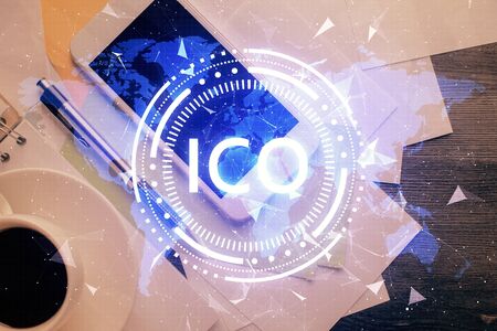 Double exposure of blockchain theme hologram over table with phone. Top view. Crypto technology concept.の写真素材