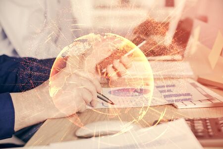 Double exposure of mans hands holding and using a phone and social network theme drawing.の写真素材