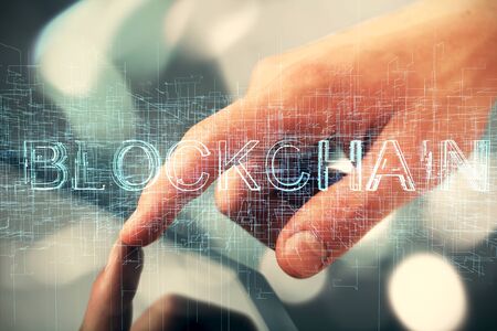 Double exposure of mans hands holding and using a phone and crypto currency blockchain theme drawing.の写真素材