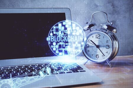 Multi exposure of blockchain and crypto economy theme hologram and table with computer background....